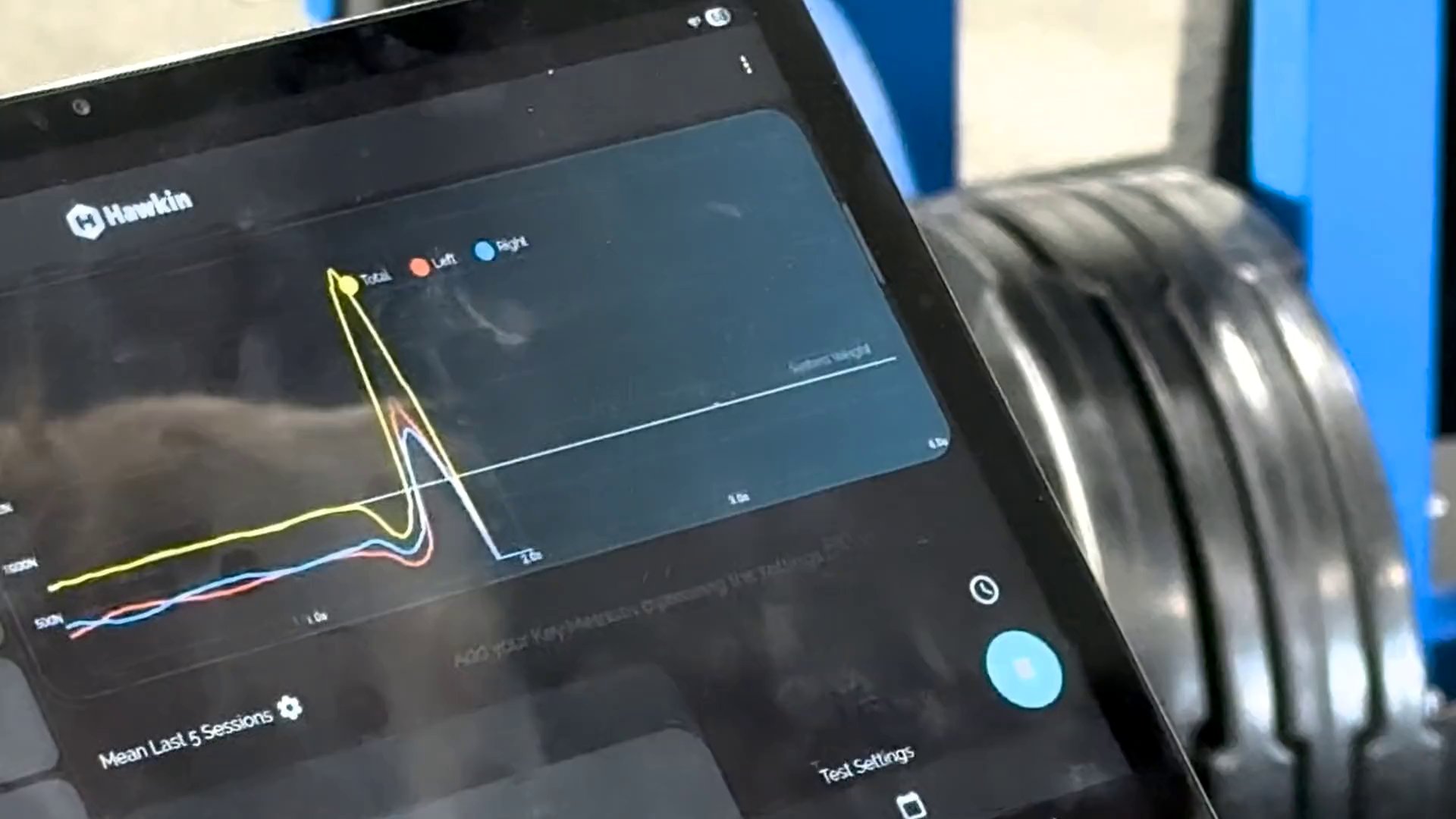 Live Hawkin Dynamics force trace on a clinician's tablet during a multi-rebound jump test