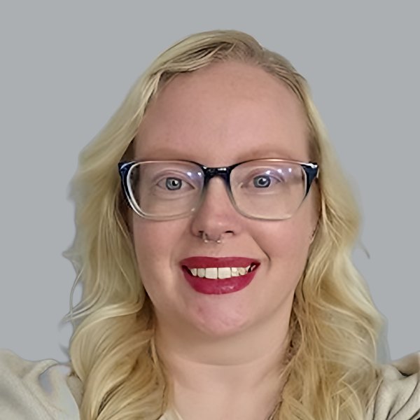 Kat, iTOP team member, smiling in a portrait