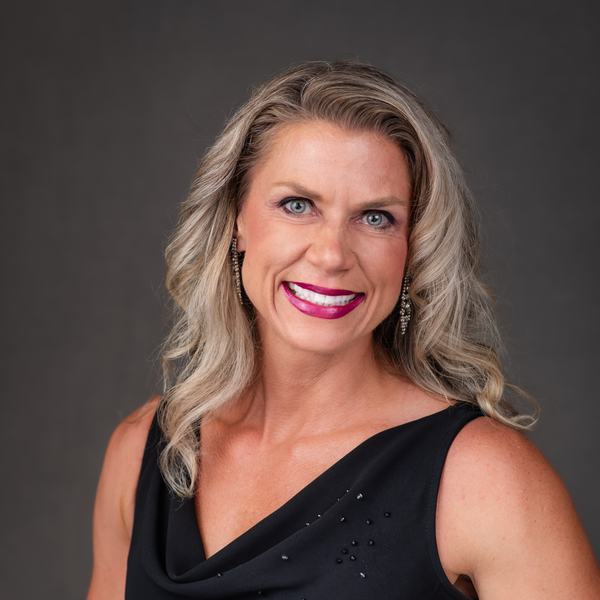 Stephanie Strong, iTOP Director of Physical Therapy and Sports Performance, smiling in a studio portrait